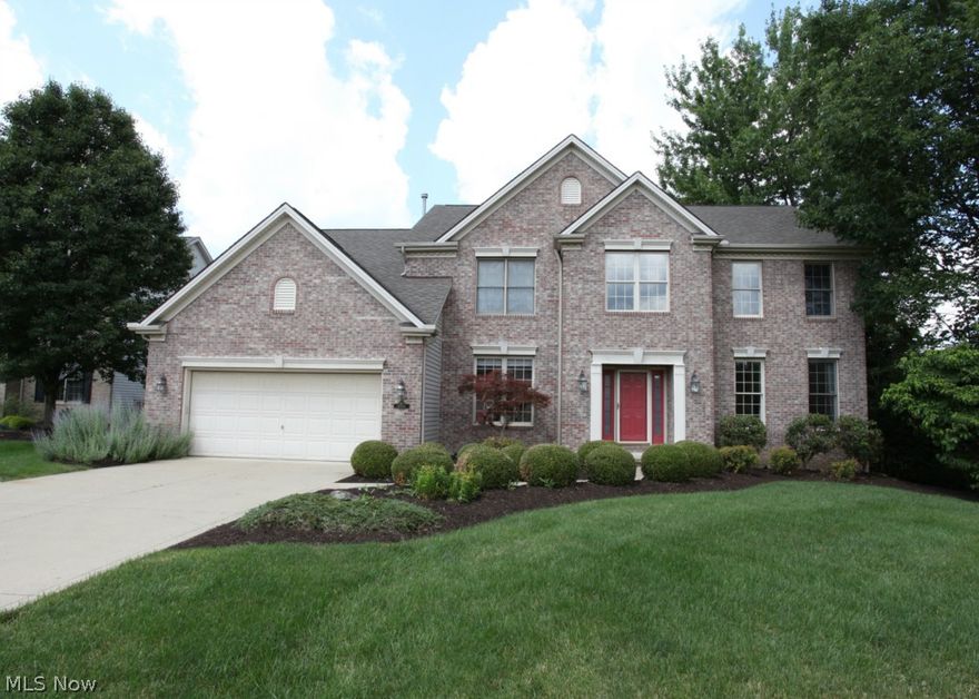 Waterford Crossing Brick Beauty on a Premium Park-Like lot. Truly move in condition! Custom upgrades include; hardwood floors throughout, updated light fixtures, 9ft ceilings, stone fireplace with convenient gas logs,and a full finished lower level with garden grade windows. The gourmet kitchen includes upgraded granite, appliances, and a walk-in pantry. Deluxe master bedroom features a vaulted ceiling, sitting area, his & her walk in closets, upgraded bath with tile & custom tub. Deck leads to stamped concrete patio and lush landscape. This home is an Entertainers delight!