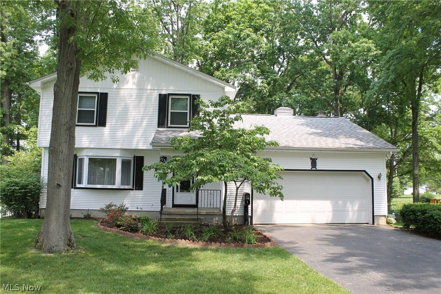 Ever dreamed of having a home on Woodside Lake in Austintown? Well, here is your chance! This first time offered home really has so much to share! Not only are you treated to gorgeous views of the Lake, you have a great size back yard, fenced with nice covered and uncovered decks! Nice fresh front landscaping gives some excellent curb appeal out front and wait until you step inside! The hardwood flooring has just been professionally refinished! The spacious living room has gleaming floors, great natural lighting and leads to the formal dining room, a picture window with a breathtaking view! The kitchen comes complete with appliances, great cabinet and counterspace and room for a table and chairs. First floor family room is carpeted, paneled and glass slider doors take you to the covered deck and backyard. Half bath on first floor. Up the refinished hardwood staircase to the second floor. Full bath. Bedroom 3 is nicely carpeted and a deep closet. The master and bedroom two are nice size