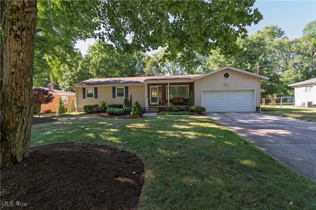 This beautifully updated ranch in the heart of Tallmadge offers the perfect blend of comfort, charm and convenience. The spacious kitchen is ideal for cooking and entertaining. The three-seasons room and expansive deck overlook a huge backyard which is perfect for gatherings, gardening, or play. The cozy family room featuring a warm fireplace, perfect for relaxing evenings.
The oversized master suite is a true retreat, boasting dual vanities, a large walk-in closet, and a luxurious en suite bath complete with an enormous dual shower and soaking tub in a spa-inspired wet room. First floor laundry makes this easy for all ages. The full basement is partially finished, offering even more space for recreation, hobbies, or storage. The garage has an EV/electric charging station for your electric vehicle.
Located on a generous lot and close to shopping, schools, and parks—this home has it all!