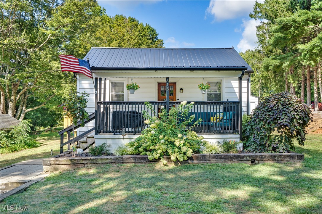 Don’t miss this adorable updated 2-bedroom, 1.5-bath home situated on over half an acre! Enter inside to find many modern updates throughout, including durable vinyl flooring and energy-efficient vinyl windows. The open and inviting living spaces are perfect for relaxing or entertaining. The kitchen comes fully equipped, with all stainless steel appliances included, making your move seamless. Enjoy peace of mind with a newer metal roof and low-maintenance vinyl siding. Outdoors, the expansive backyard is ideal for gatherings, complete with a stamped concrete patio and a brand-new oversized garage with concrete floor—perfect for storage, hobbies, or a workshop. Featuring a welcoming front porch and a side mudroom entry that opens onto a lovely side deck, this home offers both comfort and convenience. Additional features include two driveways for ample parking and easy access. This property combines modern updates with outdoor space and functionality. Schedule your showing today!