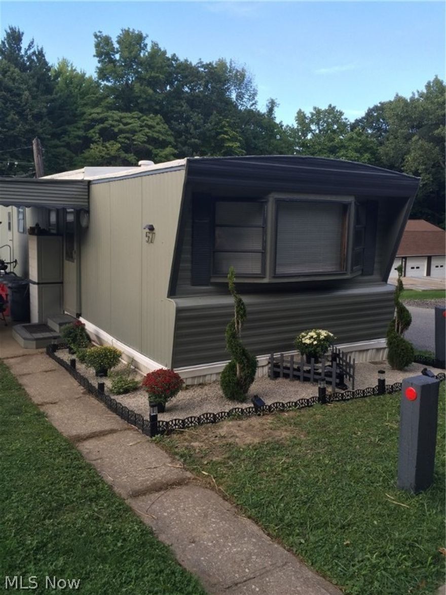 Kirtland Mobile home park offers this affordable living unit. 2 bedrooms with updated kitchen is open to the large living room. Nice sized master bedroom with a smaller second bedroom. Large bath, laundry room with washer and dryer included. Low maintenance, recently painted. Nice home  that sits at the end of the street with a vacant lot next door makes this a nice more private unit.