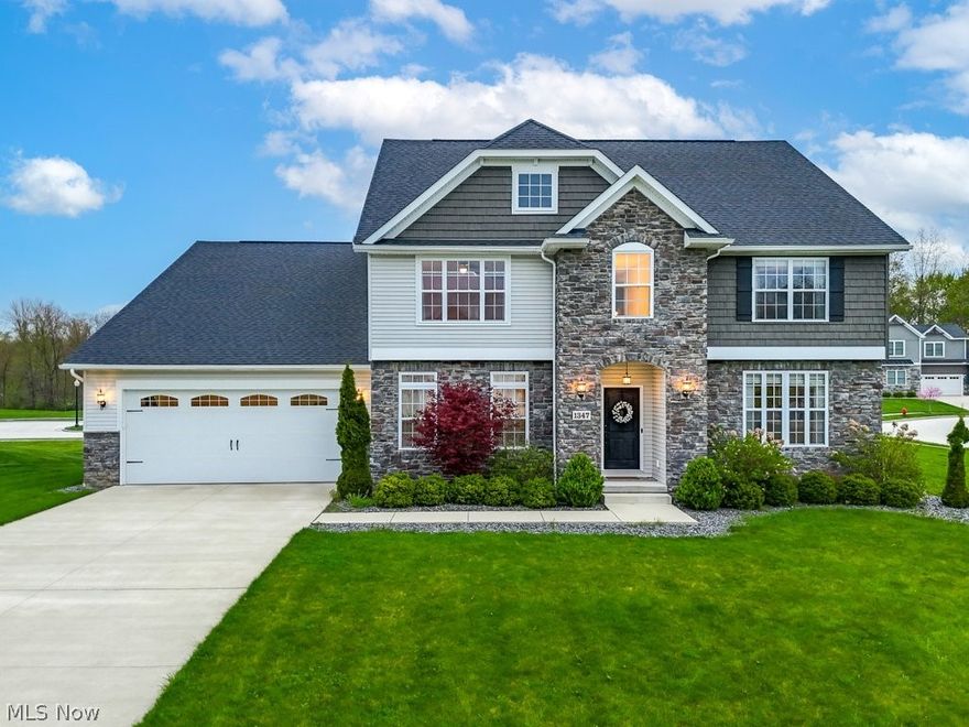 Here’s your chance to live in Kent’s highly desirable River Bend Community! Built in 2019, this 5 years young, meticulously maintained 5-bedroom, 3.5-bathroom home offers over 4000 square feet of living space. Enjoy a Bright and Open floor plan featuring a large foyer flanked by a formal dining room and an airy den. Gather in the spacious Great Room, complete with soaring ceilings and a gas stone fireplace surrounded by a bank of floor-to-ceiling windows. The adjacent Eat-in kitchen boasts Stainless Steel appliances, Granite countertops, subway tile backsplash, island with seating, walk-in Pantry, and an abundance of Custom Cabinetry. The main floor also features a well-placed Bedroom and 1/2 bath, providing flexibility and convenience for guests. Enjoy the ease of the 1st floor Laundry and the Mudroom attached to the roomy 3-car garage. Upstairs is a Spacious Loft that provides a unique vantage point overlooking the Great Room and main foyer and could accommodate a reading nook or small work area and 4 generously-sized bedrooms - including two with Ensuite baths! The spacious Master Suite features 2 walk-in closets, a dual sink vanity, a walk-in shower, and private water closet. The full basement has an abundance of storage space and features a full window w/egress that presents endless possibilities for additional living space! Step outside to your own private oasis on the deluxe Stone patio (2023), featuring a built-in gas fire pit, gas grill, stone wall with seating, timed lighting, and Granite countertop. Updates include Landscaping (2023) and stone mailbox (2021). With direct access to the Portage Hike and Bike trail across the street, outdoor enthusiasts will delight in the ease of recreational activities at their doorstep. Located across Route 43 from Roosevelt HS with easy access to downtown Kent’s dining, shopping, and entertainment and minutes from Kent State University, I-480 and the Ohio Turnpike! Make an appointment to come see this Turn-Key gem today!