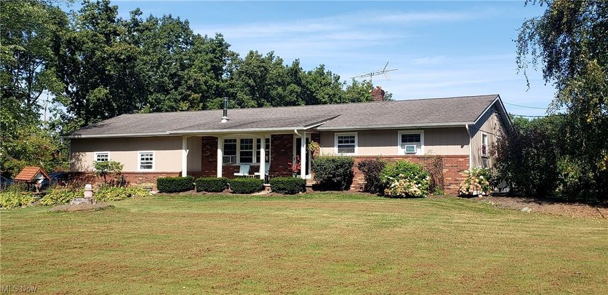 Spacious Ranch with in-law suite on 3+ Acres on secondary road Huntsburg Twp. Stunning  custom Maple kitchen with lighted cabinets, large Island, granite counters, ceramic floors and all the appliances. Open concept to dining and living room. Main home offers 2 Br’s (could be turned back into 3), updated full bath, Lower level Rec. room with Pellet stove, office (or bedroom), utility room and large storage area.  1st level In-law suite offers kitchen and living room combo, bedroom &  full bath with separate entry.  Home has newer replacement windows, newer Pex plumbing, glass block windows in basement and wired for generator.  28x32 with garage/outbuilding (with hayloft area), 220 elec., water (needs repaired) & 32x10 covered patio area. Rear deck overlooks open rear yard with invisible fence for your fur babies.