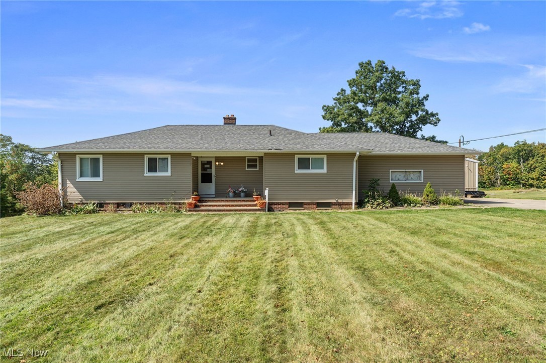 Don't miss this wonderful 3 bedroom ranch with walk-out basement and 4 car garage resting on 4.75 gorgeous acres. The interior boasts an absolutely gorgeous and completely renovated kitchen with loads of cabinet/counterspace, center island, quartz countertops, recessed lighting, LVT flooring and all stainless-steel appliances stay. Dining area just of the kitchen opens to the lovely living room with lots of natural sunlight and direct access to the rear deck. Hardwood floors throughout the first floor. Three nicely appointed bedrooms and a full bathroom round out the first floor. The Lower level with full bathroom and walk out access to the backyard has been completely waterproofed affording endless potential - just waiting for your finishing touches. Numerous upgrades: Electrical 2025. Kitchen and dining area 2023. Siding and windows 2022. Additional (2 car garage) 2019. Basement waterproofed/ new roof 2015. ADT alarm system on-site. Close to freeway access, shopping and restaurants. This is a wonderful home, location and opportunity!