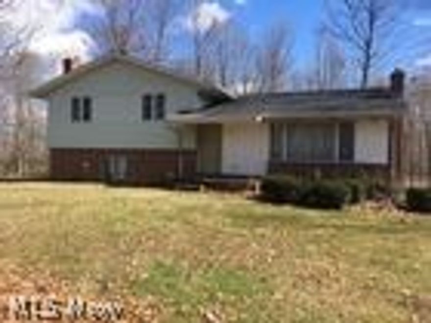 What a great auction opportunity for 2020!  I’m sure if you have traveled Kidron Road, you have thought what a great setting for a home - just off the road enough and the wooded back drop.  Now it can be yours!  The Romey family built the 3-bedroom split level house in 1974.  It has 1,344 square feet of living space.  Home has a very open floor plan on the main floor with a kitchen, living room, & dining room.  The entry level has a family room w/ fireplace and mud room.  The upper level has 3 bedrooms, full bath, and laundry room.  Basement and 2-car attached garage add to the pluses of the Romey house.  Property has several outbuildings including a cemented flat barn.  All this is on 5.4 acres.  Parcel #2 is a 3.3 acre lot adjacent to the north of Parcel #1.  This lot is partially wooded and has the famous Romey ice skating pond on it.  Parcels will be offered separately and together.  They will sell in the manor which brings the most.