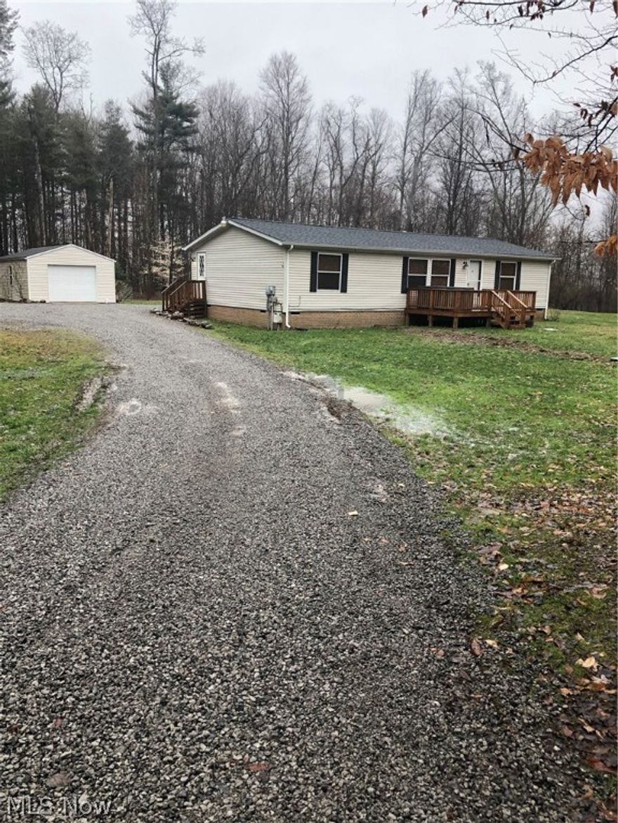 Welcome to Guilford Pass with just a few minute walk to Guilford Lake and Marks Landing...Warm, inviting and private is what you will be greeted with when you walk through the door. This open floor plan offers an extremely large great room featuring one full stone wall w/built in 80" flat screen TV, electric fireplace and custom oak beam.  Kitchen offers upgraded appliances, ample cabinetry, copper sink and large bar for entertaining, The dining room is large w/sliding door that leads out to the covered wood deck w/recessed LED dimmer lighting.  There are two bedrooms in this home. Seller wanted a larger great room area so one wall was taken down so there is an option for three bedrooms. Bedrooms have extremely large walk in closets. Master bath offers a garden tub and separate shower. Both full baths offer a unique feature where one light in each can be transferred to a blue tooth speaker. Laundry area and ample storage complete this home. (roof 2019)..Also included in this sale is Parcel # 27-03785.008 on 1.329 acres. 
 Taxes reflect both parcels.