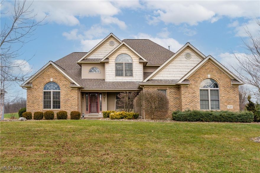 Welcome to this impressive 5+ bedroom, 4.5 bath residence offering over 4,000 sq ft of beautifully finished living space, ideally situated on a picturesque lot in the highly sought-after Mudbrook Village neighborhood of Jackson Township. Enjoy breathtaking sunset views over the pasture from the private composite deck or the like-new stamped concrete patio—perfect for relaxing or entertaining. The main level features a first-floor primary suite with tray ceiling, spa-like bath with jet tub and walk-in shower, and generous closet space. A private office/den with French doors sits just off the soaring two-story foyer. You’ll also find a formal dining room with rich woodwork and a dramatic two-story great room with gas fireplace that flows into the spacious eat-in kitchen featuring granite countertops, center island, newer appliances and sliding door to the deck. Upstairs offers a junior suite with private bath, walk-in shower and oversized walk-in closet, plus two additional bedrooms sharing a full bath with double vanity and private commode/tub-shower area. The finished walkout lower level provides exceptional versatility with a large rec room, custom wet bar, bedroom/office, two bonus rooms, full bath with walk-in shower, and abundant natural light with patio access.
Recent updates include new kitchen appliances (2025), hot water tank (2022), AC unit (2019), and stamped patio/steps (2020). Additional highlights include first-floor laundry, 1/2 bath/powder room, Corian bath counters, natural gas firepit, 3-car sideload garage with hot/cold water and abundant storage throughout. Set in a picturesque neighborhood with streetlights, curbs and uniform mailboxes, this home is ideally located near Jackson’s North Park & Amphitheater, Sauder Elementary, Jackson Memorial Middle School, Jackson High School, Nobles Pond shopping & dining, Lake Cable, CAK airport, I-77, Belden Village and The Strip. A rare find in a serene and walkable community.
