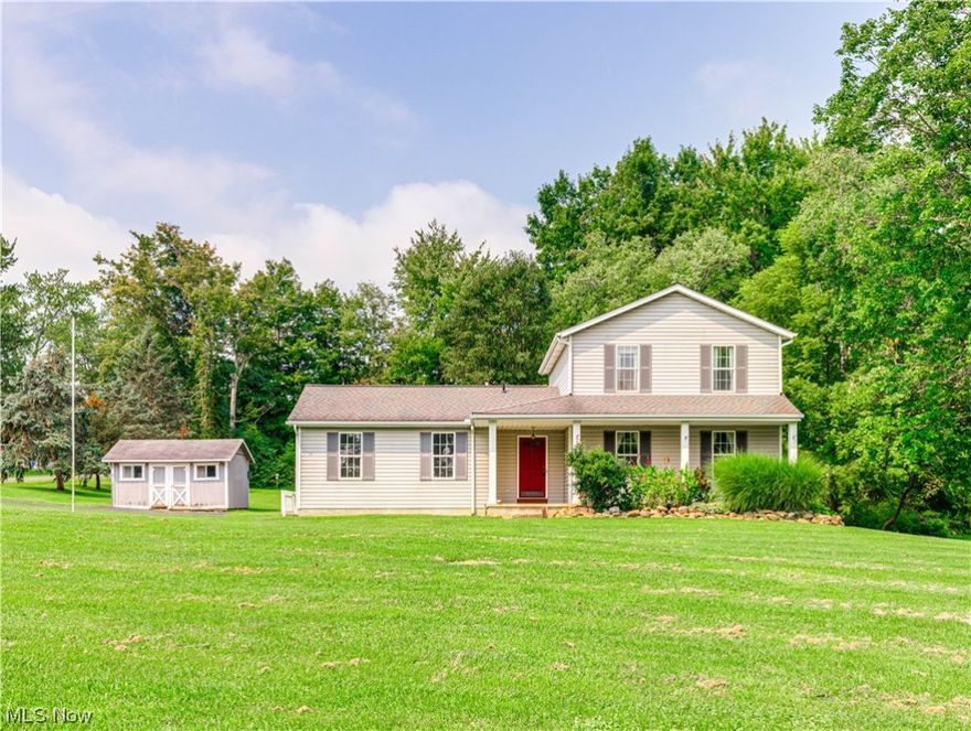 Are you looking for peace and tranquility while enjoying modern amenities? Look no further. This one-of-a-kind home is located in the heart of the Village of Peninsula steps away from the Cuyahoga Valley National Park System. Take a 5-minute walk down historic Main Street to local restaurants, stop at a farmers Market to grab some produce or hop on a train at the Cuyahoga Valley Scenic Railroad for a gorgeous ride. 5 minutes from highways. The location could not get any better.  With just under an acre of land the property boasts gorgeous gardens, a large flat lawn and adorable patio for relaxing by a summer bonfire. This is one of the newest homes in the Village. Step onto the expansive front porch and enter through the front door into the large family room. The adorable kitchen has SS appliances, peninsula with seating & connects to a quaint eat-in area with sliding doors to lovely back patio. The first floor also includes a convenient full bathroom and formal dining room for enjoyin