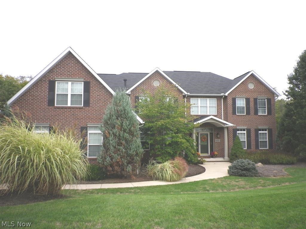 Stately 4 bedroom, 5 1/2 bath custom built home on .93 acres at the end of a cul-de-sac. Foyer entry opens to the 2 story great room, offering hardwood floors, Coffered ceiling, a gas fireplace and a full wall of windows giving way to panoramic views of the private back yard. The kitchen will delight any cook, with the 6 burner gas range cooktop, sub-zero refrigerator, and built -in oven. An abundance of maple cabinets, and granite counter tops, also includes a breakfast bar, planning desk, butler's serving station, and a walk-in pantry. Formal dining room plus spacious dinette. Two separate living areas, being used as a living room, and a den. 1st floor laundry/mud room gives access to the garage. All first floor living areas have either hardwood or ceramic tile floors. A split stairway leads to the second floor which offers 4 bedrooms, including an unmatched master suite. The master has its own two sided gas fireplace, one side facing the master bedroom, and the other side facing th