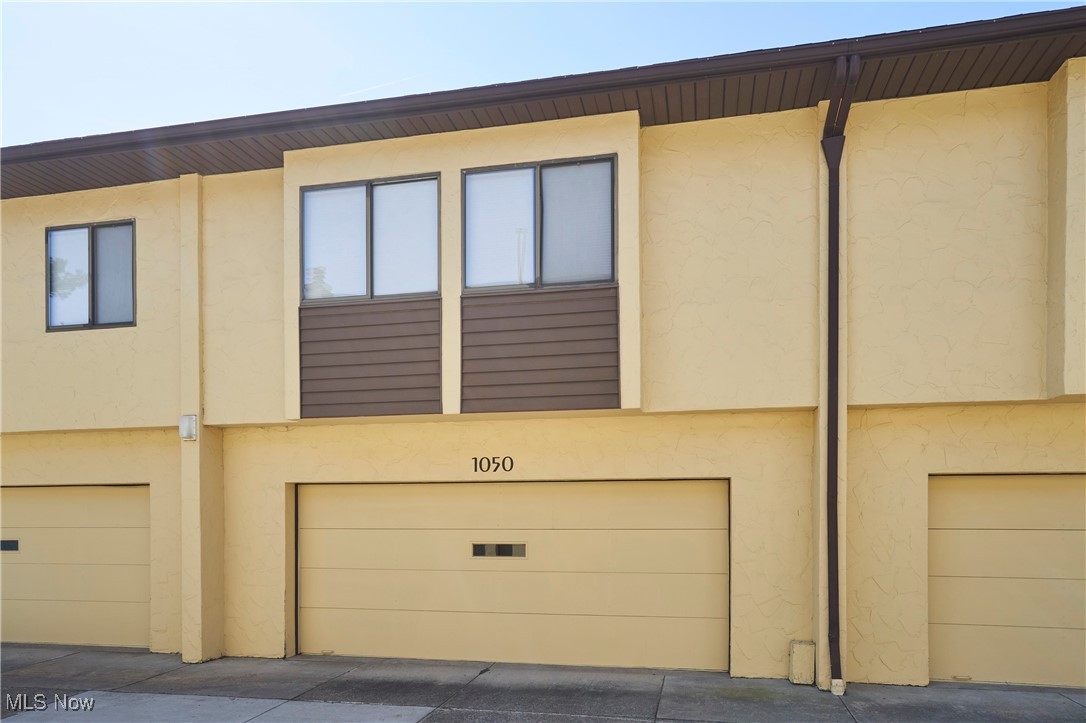 Hampton Ridge is a beautifully landscaped condo community. Excellent grounds for walking and biking along with access to pool, clubhouse and tennis courts. This unit offers a large 2 car garage with storage closets. First floor includes shared Breezeway (with private storage closet), Entry Foyer, front Living Room and separate Dining with galley Kitchen with new appliances and Family Room that has a stone fireplace and mirrored Bar / Built-ins along with sliding doors to private brick paver patio and deck. Rough sawn cedar herringbone slat walls with mirror accents create a unique look. Powder Bath on first floor as well. On 2nd floor you’ll find a very large Owners Suite with lots of closet space and en-suite bath featuring separate shower and jetted tub. Guest bedroom is spacious with large walk-in closet and full bath off hall.