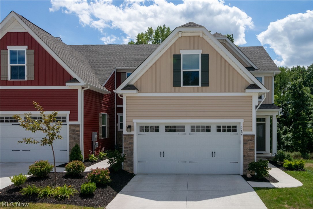 Newer construction without waiting for it to be completed! Absolutely beautiful and only 2 years young! Lots of upgrades in this end unit "Calvert" open floor plan. Upgraded kitchen includes white cabinetry, granite counters with breakfast bar area, stainless steel appliances & pantry! The combination dining area and great room are perfect for entertaining. There are extra side windows in the dining area, which allow for more natural light that are a unique feature. Enjoy access to the Trex deck off the great room to enjoy the wooded view and seasons. The first floor master suite features walk in closet and full bath with walk in shower and double vanity. The laundry and powder room complete the first floor. The walk out lower level is super nice and features a large finished area with sliders to concrete patio and black fenced in backyard! The second floor offers 2 spacious bedrooms and full bath. Need space for storage? There's plenty in the lower level. Don't wait on t