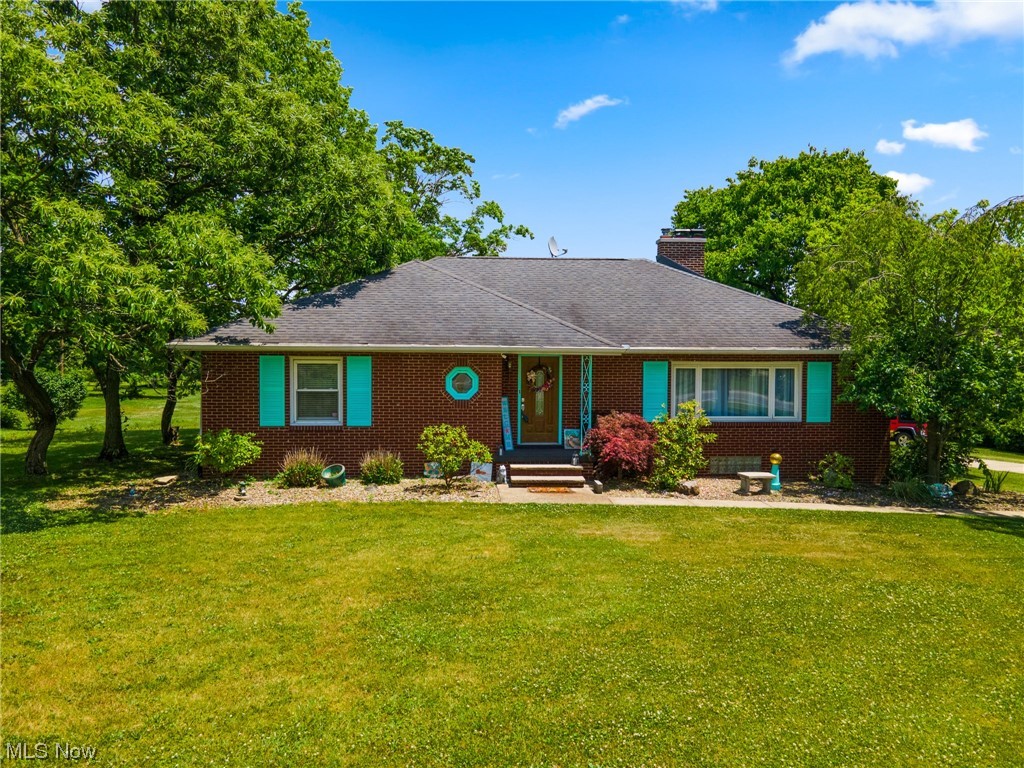 Updated brick ranch situated in a great location with 3 beds, 2 full baths, and plenty of land is exactly what you’ve been looking for! Luxury vinyl floors, quartz countertop, and under cabinet lighting are showcased in the kitchen that is open to the dining room with a beautiful custom built-in hutch. The living room is large and showcases a gas fireplace and hardwood floors. Off the kitchen is the cozy sunroom that overlooks the spacious backyard and back deck with pergola. All 3 bedrooms are situated on the first floor along with one of the full baths that has a jetted tub, walk-in shower, and new vanity top. In the finished walk out basement you’ll find the laundry along with tons of cabinet space, a second full bath, a wet bar, along with tons of space for an additional living space or whatever you’d like! A 1 car attached garage, 20x30 detached garage with electric, and 50 amp plug on the garage for an RV are just the cherries on top of this awesome home! Additional updates inclu
