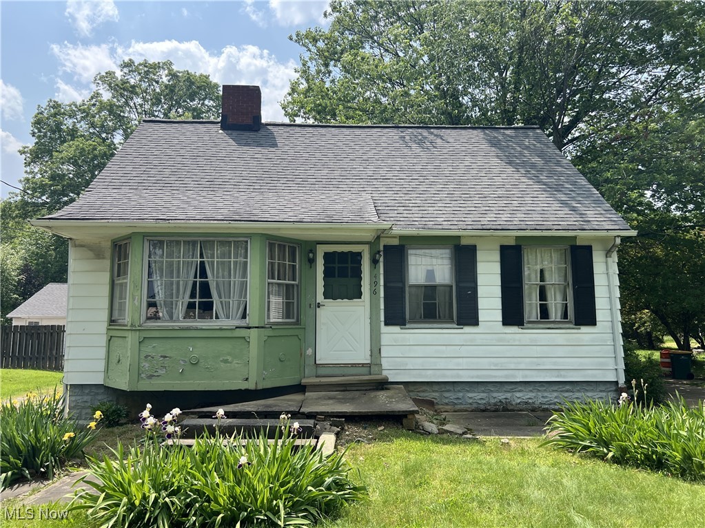 Welcome to this cozy 3-bedroom bungalow, nestled on a spacious half-acre lot and full of potential. With a little TLC, this could be the perfect place to call home. The main floor features a comfortable living room highlighted by a wood-burning fireplace, and a kitchen with ample cabinetry, a double sink, and an included fridge and stove. Enjoy your morning coffee in the charming breakfast nook. The first-floor bedroom offers the ease and convenience of main-level living. A full bath completes this level. Upstairs, you'll find two bedrooms and a full bath. The lower level features a laundry area and additional storage space. Step outside to a deep backyard—ideal for summer gatherings, gardening, or simply relaxing. A detached two-car garage adds convenience. Located near North Chagrin Reservation, local restaurants, shopping, and with easy access to the freeway. Don’t miss this opportunity to create your own retreat in a peaceful setting with room to grow—schedule your showing today! Home is being sold as is.