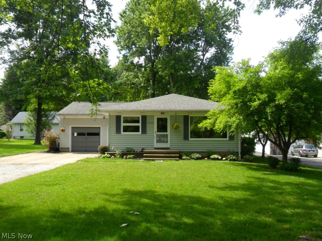 This lovely, well-maintained 3 bedroom, 1 bath ranch home provides both charm and functionality. The interior decor is warm and inviting. The kitchen makes great use of available space; it even includes a breakfast nook (includes newer appliances). The dining room has nicely finished hardwood flooring and finished pine wood walls. The spacious living room is inviting and comfortable with large windows and a decorative mantle space. The carpeted master bedroom has a charming decor and adequate closet space. The additional bedrooms have hardwood floors; one has finished pine wood walls. The bathroom has a clean, bright decor and full-size tub/shower with functional vanity space. The partially finished basement (completed 3 yrs ago) provides added living space that is great for entertaining. Outside you'll find a spacious, treed lot with 1 car, attached garage, outdoor paito, and additional screen-room patio space (re-screened 5 yrs ago) perfect for enjoying relaxing summer eveni
