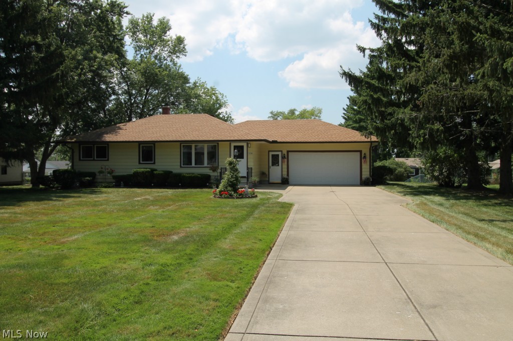 Gorgeous Original owner, three bedroom Ranch home with two full baths situated on a beautifully landscaped lot. Meticulously maintained, just waiting for its new owner to occupy and put their own touches in this house. Walking up the large driveway to the house, there is a small front porch/stoop area as you enter the front door the generously sized family room greets you. Carpet has been replaced, 2015. The kitchen has a lovely eat in area with ample cabinet storage and counter space. There are three spacious bedrooms and two full meticulous bathrooms. Roof and furnace have been replaced in 2006; Stove, Chimney and A/C replaced in 2012; Hot Water Tank replaced in 2011; Garage Door replaced in 2008; Garage is heated with hot and cold water. Newer Windows in 1997 with some warranty left. Drains have just been cleaned out, 2015. There is a very spacious, large backyard and a back porch where you can sit out and enjoy the beautiful scenery. The expansive finished basement has a