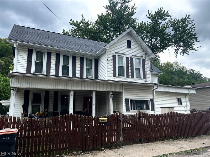 Turn potential into profit! Classic character located just blocks from the Ohio River. This spacious home offers incredible curb appeal with a gabled roofline and a deep, covered front porch- perfect for evening relaxation and river breezes. The fenced-in yard and unique architectural details provide a fantastic canvas for your creative vision.