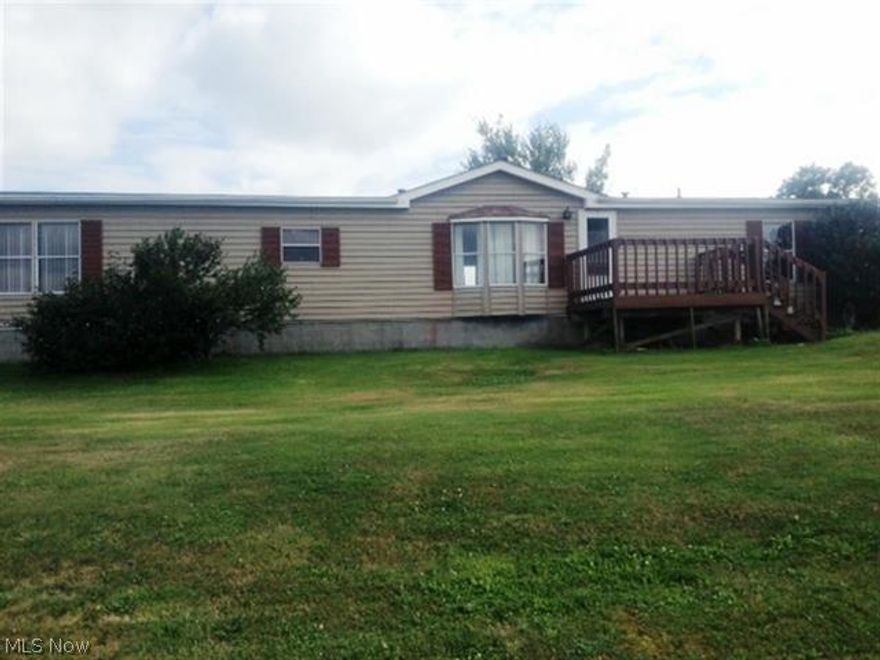 Country living only 3.3 miles from Rt.7. Fenced in level yard, front and back decks..Gas rights do not convey.New laminate floor in master bedroom