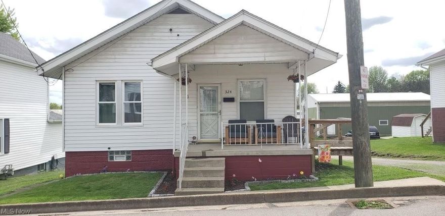 You can move right into this cozy, two bedroom home on a corner lot with many updates, including an updated kitchen and flooring, a newer furnace and central AC, and first-floor laundry. There is a walk-out basement that leads to a spacious, flat, and newly fenced-in back yard.  This would make a great starter home or investment property.