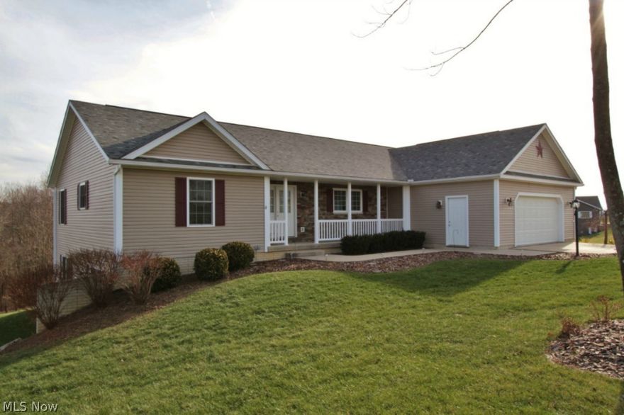 Generously sized L-shaped ranch style home with walk-out lower level! Lovely, well maintained interior! Fully equipped, bright and cheerful kitchen includes hardwood floors and hickory cabinetry! 4 bedrooms, 3 full baths (master bath includes relaxing garden tub and separate shower!)  2 laundry rooms add convenience! Gas fireplace and lovely built-ins highlight the great room. Lower level offers 3 sets of double windows, large family room, office or study, and opens onto a concrete patio & covered 25.6 x 8 porch overlooking the large back yard and woods! Tri-Valley Schools! This is a spacious, light and open home in move in condition! You don't want to miss this!