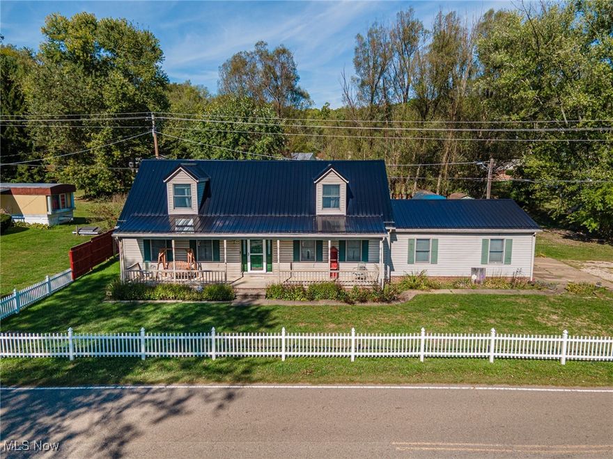 This is a beautiful property in a country setting just outside of town! Three bedrooms, 2 1/2 bathrooms and a family/recreational space in the basement with a working wood burning stove. The owner's suite is on the main floor and features a large walk-in closet, soaking tub, shower and large vanity. The two upstairs bedrooms have charming dormer windows, big closets and their own full bathroom. Also on the main floor are an open kitchen/dining room, a half bath, and a sunny living room. Outside, a beautiful country front porch, a back patio with a fire pit and a large flat fenced in yard! You need to see this!
