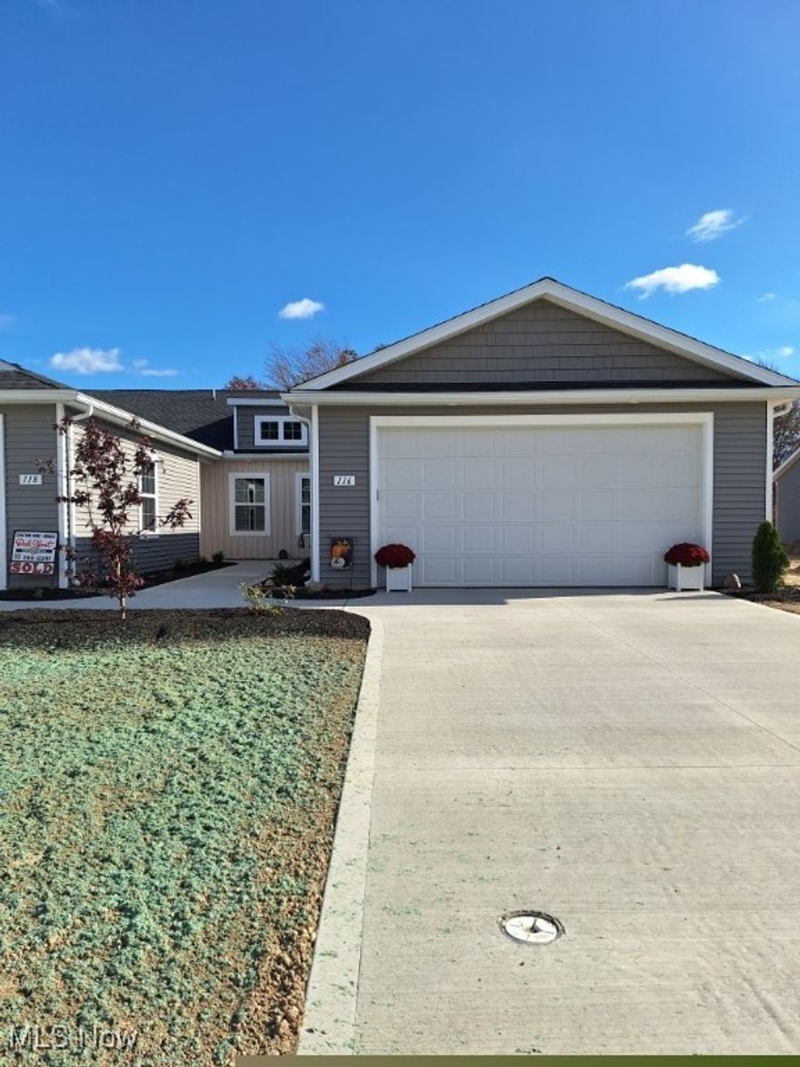 Welcome to 116 W Spring Dr. Located in Landings at Ridgewater Community. Come see this beautiful 2 bedroom & 2
bath ranch cluster home. Only a few months old. Why go through the hassle of building when you can just pack up and
move right in? The location is perfect. It is an end unit with a vacant lot next to it and it is also, has great views of the
HOA reservoir. That means additional privacy because there and no neighbors behind you. These are 2 great upgrades
that the seller chose. Upgrades approx. $33,480.00. The list of upgrades are uploaded in MLS supplements.  Enjoy the views from the inside or the outside while relaxing on your covered spacious 10x21 patio. It is also great for entertaining with family & friends. There are many additional upgrades and features including all new upgraded appliances except the refrigerator which is a few years old but has an extended warranty on it.  Laundry room also has cabinets for storage and a sink. There are 9 ft ceilings
throughout except in the great room where there is a vaulted ceiling which adds a more dramatic design. Kitchen has a
very large quartz breakfast bar that provides extra seating, a buffet area or other multiple uses. Beautiful, beveled
subway tile back splash. A pantry for extra storage space. Lots of maple cabinetry. Enjoy the roomy Master bedroom
suite with a full bath and large walk-in closet. 2nd. bedroom is also a comfortable size with spacious closet, or it could
also be used as an office. Oversized 2 car attached garage for extra equipment. No steps to worry about or the grass
cutting & snow removal. Use that time for relaxing & fun things to do. So many other fine features that you need to
come see for yourself. You won't be disappointed. A great place to call home.