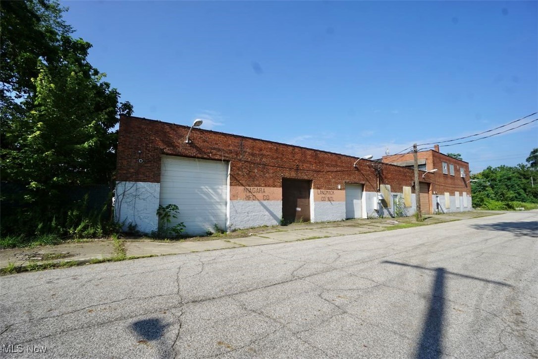 Opportunity awaits in this 15,000 sq. ft.+/- industrial building with versatile potential for automotive, warehouse, or light manufacturing use. Built over a century ago, this solid brick facility carries historic character and functional space, with multiple drive-in doors, high ceilings, and open-span floor areas to accommodate a variety of operations. The property is located just 5 minutes from freeway access, providing convenient transportation and distribution routes. While the building does need a roof replacement and some updating, it offers an extremely affordable price point, making it an attractive option for an owner-user or investor looking to customize to their needs. Drive in dock can accommodate a 40' trailer. With its size, structure, and flexible layout, this property represents a rare opportunity to secure substantial industrial space at a bargain price.