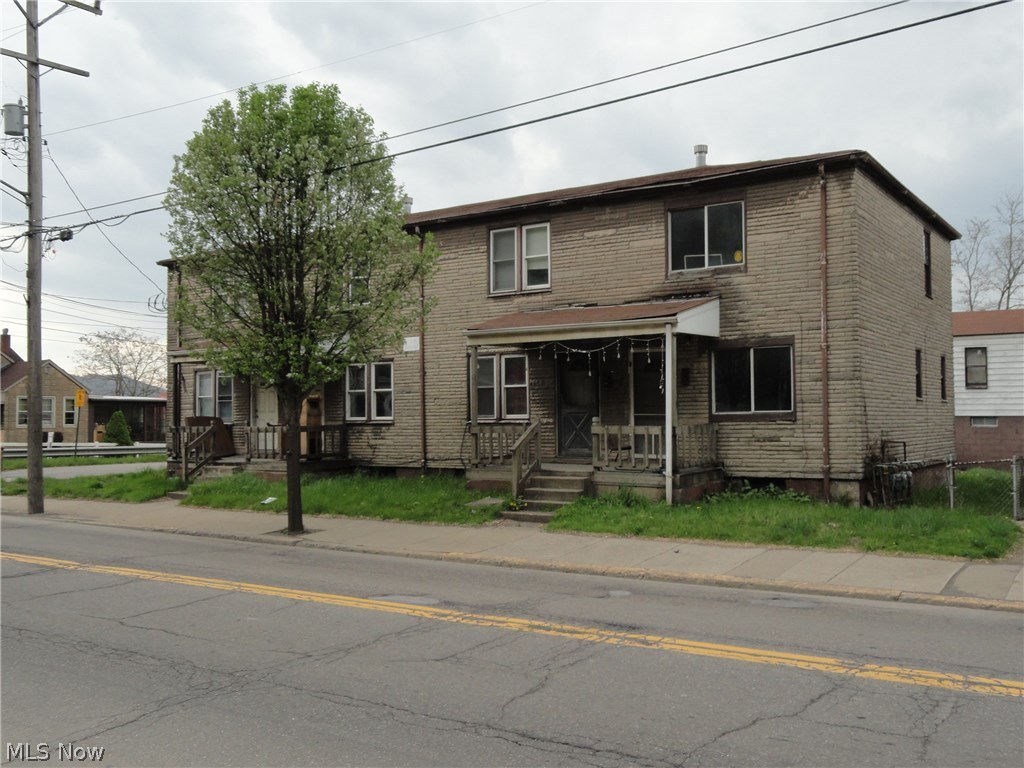 2 Buildings house 6 spacious 2 BR apartments w/adequate parking & 3 garages in the back building. Selling AS IS.