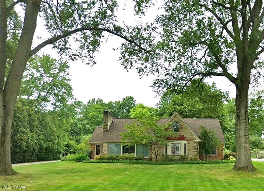 Deceptively spacious Fairlawn Heights brick Cape Cod on a charming, lightly traveled one-block street. Nearly 2,800 square feet plus a beautifully finished lower level offer flexibility for first-floor living or growing households.  Main level features two bedrooms connected by a Jack-and-Jill bath, plus a full hall bath serving the primary bedroom — a practical layout that offers flexibility and privacy. Hardwood floors and oversized windows enhance the home’s warmth and natural light, while central air provides modern comfort. Living Room with traditional woodburning fireplace and marble surround opens to a sunny Dining Room. The eat-in kitchen includes a charming breakfast nook with built-in china cabinet. A cozy paneled Library with built-in shelves and two closets creates the perfect retreat. The delightful breezeway or sunroom connects beautifully to the private backyard.  Upstairs offers a spacious loft, two additional bedrooms, and a hall bath, providing comfortable separation for family or guests.  The lower level impresses with a wormy chestnut–paneled Rec Room featuring a second woodburning fireplace and mirrored wet bar. A former kitchenette now serves as a flex space (hobby/sewing room or guest room). Additional unfinished space includes workshop, storage, laundry with chute, and a lower-level shower bath.  Private patio, garden, and backyard invite seasonal enjoyment. Extra parking pad on extended driveway accommodates three additional cars. New roof (2020).  Come see why residents love Fairlawn Heights for its varied architecture, parklike setting, and proximity to shopping, dining, schools, parks, and highways.  Classic character. Exceptional flexibility. Larger than it appears — and lovingly maintained.