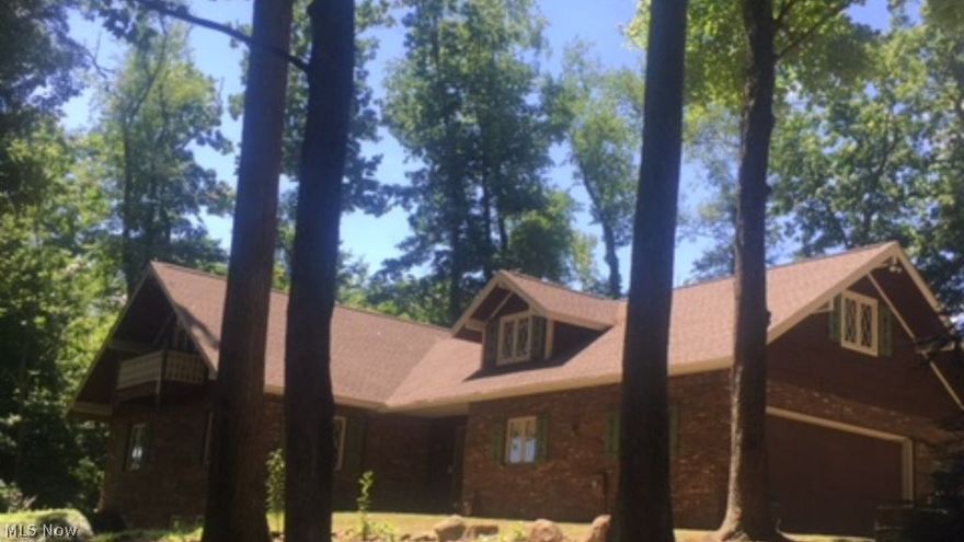 Secluded custom built home on a five acre private setting overlooking a half acre pond. 2 car attached garage. Large detached garage/workshop. Handmade custom woodwork throughout. Total square feet includes Approx 1,200 sq ft of finished walkout basement. 2 fireplaces, 2 year old roof, 1 year old driveway, newly built family room with fantastic view.