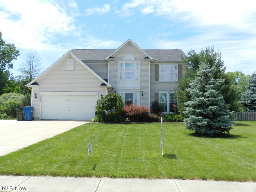 Exceptional RESORT STYLE colonial with fin basement, Large heated pool, fenced lot with treed rear yard views! Desirable neighborhood with ez access to highway/shopping (No Association). Gorgeous home that boast of recent true CHERRY HARDWOOD flrs throughout the first flr ($10K+ upgrade). Light/bright interior w/ white kitchen that includes STAINLESS appliances, center island and open to the relaxing family rm with brick fireplace included for those winter evenings! Formal Dining for holiday gatherings. 1ST flr laundry. Fin bsmt is outstanding with putting green. Custom INGROUND POOL ($60K+ upgrade), extensive deck/PAVER PATIO area with safety fence/fire pit! Double doors to spacious master, wrought iron spindled, Invisible dog fence, more. $ Reduced, Best Buy in North Ridgeville!