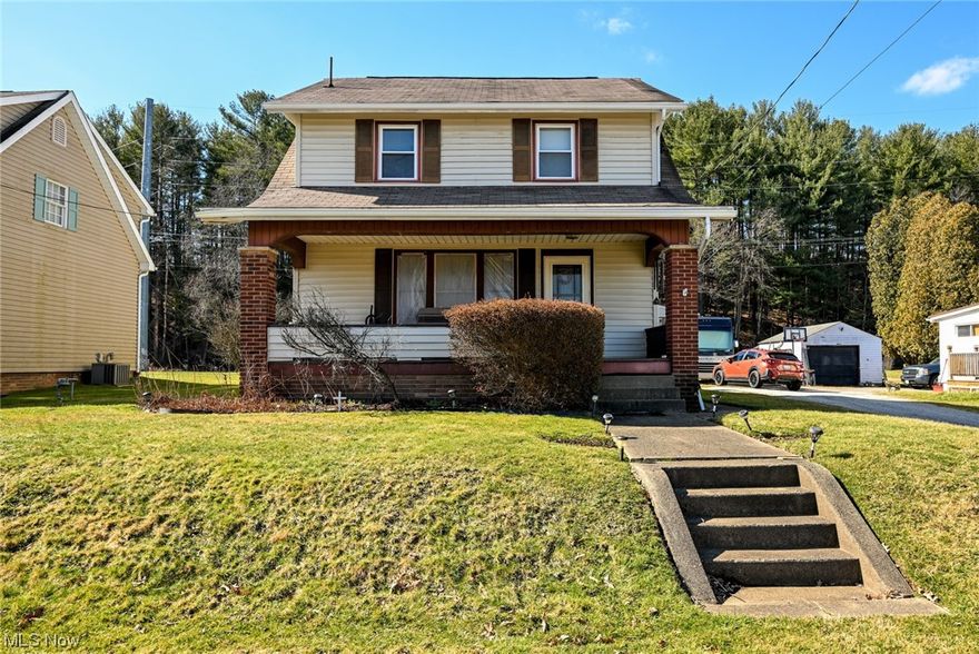 Just what you have been looking for!  Welcome to this fantastic 4 bedroom home in the heart of East Sparta!  Sitting on an extra large lot with a 2 car garage, composite deck and fireplace.  The large covered front porch is the perfect spot to sit and enjoy the neighborhood.  Inside, we'll start with the family room.  This great addition provides so much extra living space!  Featuring laminate flooring and an independent heat source.  One step up brings you into the oversized formal dining room with great natural light and original woodwork.  You will love the charm of the kitchen's tile walled breakfast nook.  There is still the formal living room on the main level too!  On the second floor you will find 3 bedrooms and a full bathroom.  The third level offers a 4th bedroom or bonus room as well.  You will definitely appreciate the convenience of a second full bathroom in the basement too!  Windows replaced in 2018, new water heater in 2020.  This beautiful home is a must see.  HURRY before it's gone!!