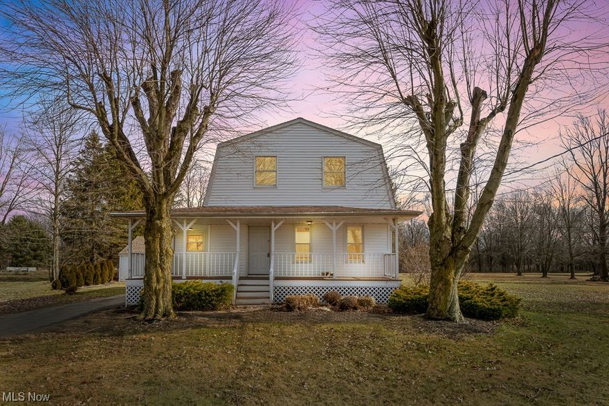 Welcome home to this magnificently well-kept century farmhouse on acreage in desirable Canfield! Featuring wonderful charm and updates in all the right places, you'll love to call this your next home! Enter the front door from the grand wraparound front porch and into the huge living room, featuring a lovely fireplace and plenty of space to relax. The large kitchen is a dream, featuring stainless steel appliances, an great eat-in peninsula, plenty of counterspace, cabinetry, and a large pantry. Off of the kitchen is the dedicated dining area with new flooring, a recently renovated full bathroom, and first floor bedroom with new flooring, ideal for an office. Upstairs is roomy and spacious, with a welcoming large loft, huge master bedroom featuring his and hers closets, a revamped full bathroom, and two additional large bedrooms, each with plenty of closet space. The partially finished basement is great to entertain or relax, featuring a dry bar, nature stone flooring, and custom wood paneling. The large, dry basement also features a bonus room and an abundance of storage space. Take the party outside where you'll love entertaining on the large back deck that overlooks the serene, sprawling backyard! Located on just over 1.8 acres, a 2+ car detached garage rounds out this wonderful property. Call today for your private showing while this fantastic home is still available!