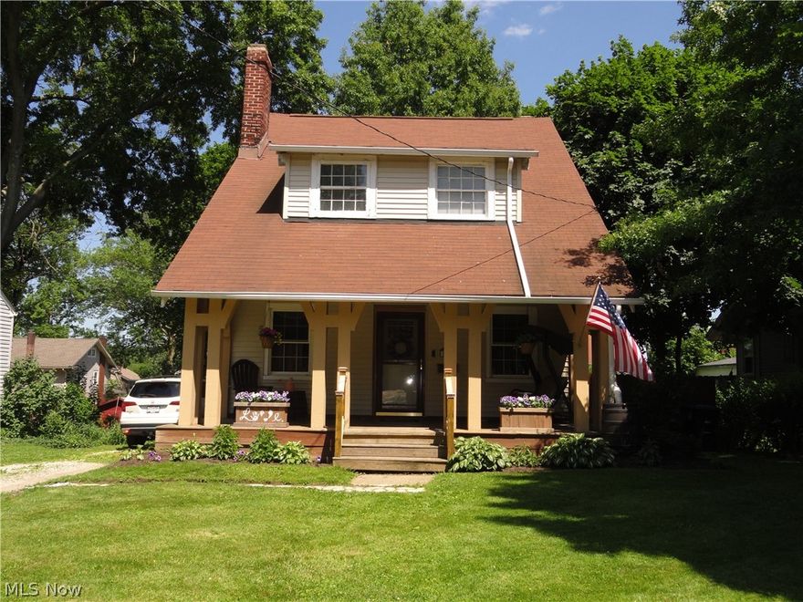 Lounge on your spacious front porch or entertain and BBQ on your concrete patio in your shaded fenced back yard.  Close to the theater, close to Goodyear Heights Metro Park, close to everything.  This charming brick home has great lighting, natural woodwork, wood floors, updated kitchen, remodeled bath, updated electric, glass block basement windows and central air. New roof in 08, some windows replaced too No stress, one year warranty included.  Charming, affordable and available.