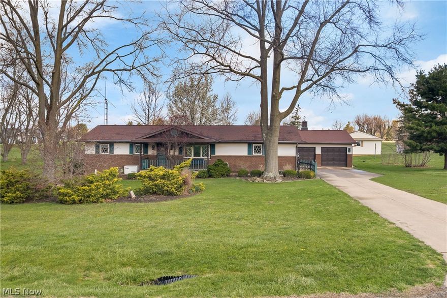 Filled with love and wonderful memories, this charming 3 bedroom, 2 bath ranch offers 1904 sq. ft. of comfortable living space.  Situated on a peaceful 1.5 acre rural lot with convenient access to Louisville, Alliance, Canton and all the amenities at Oakwood Square.  This home blends country serenity with everyday convenience.  
Inside you'll find a spacious first floor Family Room with a cozy fireplace, a welcoming Living Room, and a Kitchen featuring a bayed dining area.  A bright Enclosed Porch adds additional living space, while the oversized 2-car Garage provides ample storage.  A whole-house generator, new roof, and beautiful hardwood floors add lasting value and peace of mind.
