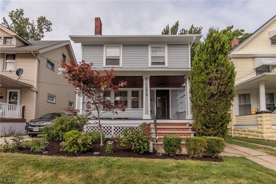 Welcome to 1274 Hall.  This charming colonial is the perfect blend of classic design and modern updates.  The front porch draws you in and invites you to stay for your morning coffee or evening cocktails. Step inside and you are greeted by beautiful woodwork in the living room including a fireplace with gas insert for the chilly days ahead.  Original bookcases divide the living room from the dining room, which features wood built-ins and a window seat.  The kitchen is a chef's dream with newer cabinetry and granite counters, plus all appliances will remain.  Upstairs you will find three large bedrooms, one leading out to a charming porch overlooking the backyard.  The main bath has been totally redone and features dual sinks, new flooring and tile.  The easily accessed third floor provides tons of storage and the opportunity for expansion.  A half bath and separate shower along with laundry, a workbench, lots of storage and updated electrical are found in the basement.  A 1.5 car garag