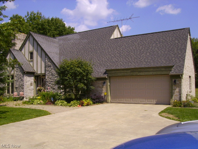 Quality, custom built stone and brick one and a half story with finished living area over 2300 SF and attached 2 car garage. Cherry wood trim, class A cabinetry and light fixtures. Finished basement w/40X19 rec room. Two outbuildings - one open shed 80X20 and 80X40 closed pole barn w/14 ft. overhead doors. Approximately one half of building is improved with geothermal for heating and cooling, office, hot and cold water and commode facilities. Water is supplied by separate shallow well and is only used for cleaning.