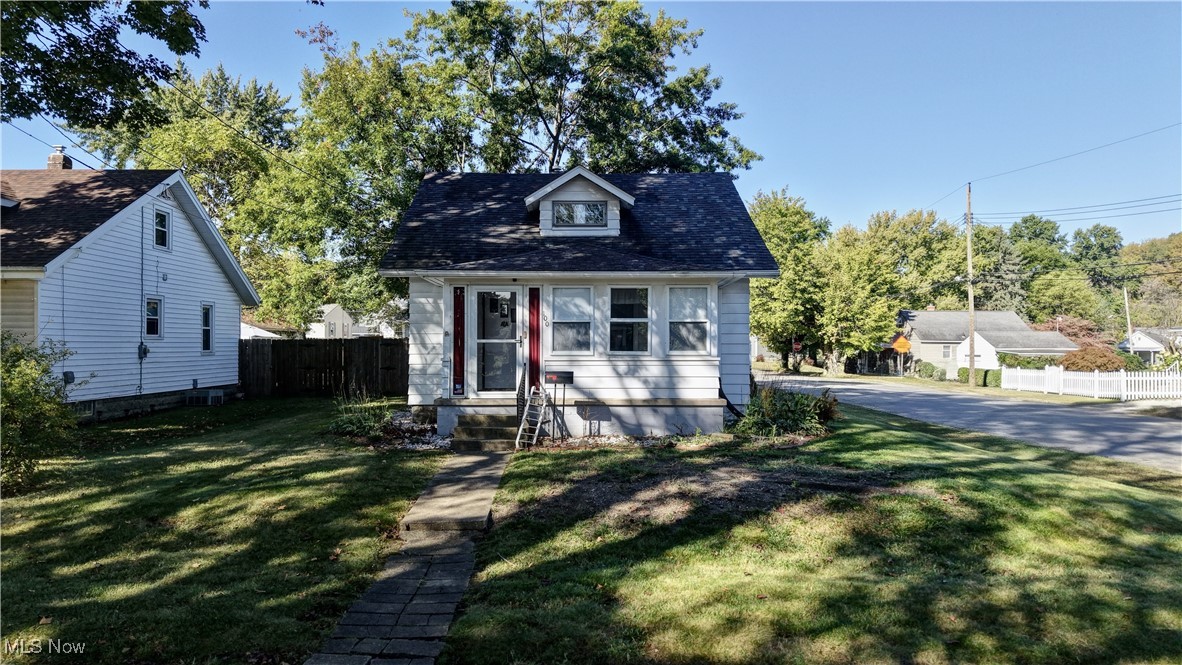 Charming two-bedroom, one bath cape cod. Come on into the closed porch area offering a ceiling fan, cozy to sit out there all year round and into the large, white living room, all new floors, carpet and painted throughout, open to the dining room. Bright, white kitchen stainless steel appliances, plenty of cabinets. There is a bedroom on the main floor and stunning full bathroom with a walk-in shower. The large second bedroom is upstairs. Full unfinished, very clean basement offers the laundry area, plenty of space for storage, exercise area, etc. One car detached garage. Furnace (2023). All you have to do is move right in!