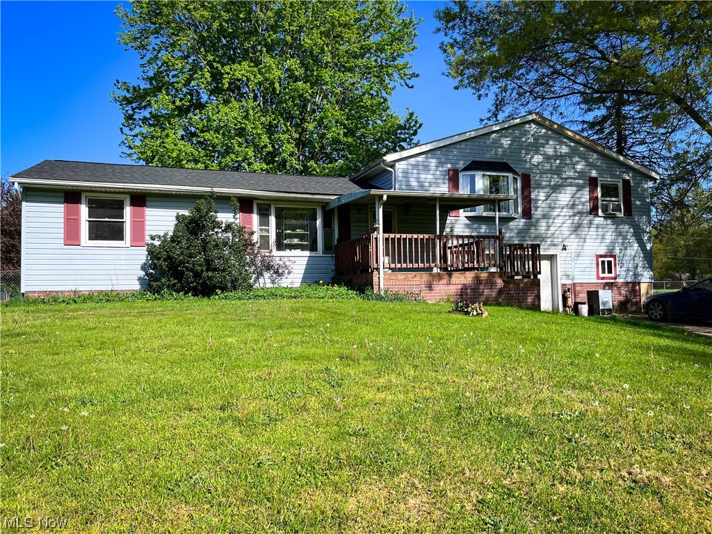 Opportunity awaits! 1,536 sqft Multi-Family Split-Level property in Rootstown township situated on 4.13 acres. The house sits way back with plenty of frontage! Main level has 2 bedrooms & 1 full bath in which is ready for finishing. The upper level has 2 bedrooms + 1 bath, plus an enclosed sunroom. Both units lead to the fenced in backyard. 2 car attached garage + 2 car detached garage + a couple of storage sheds. New Roof Nov. '22. Endless opportunity after some renovations + updating. Could make an ideal investment -- rent both out or even occupy one side & rent out the other. Partial basement. Both units have separate utilities. Rootstown Schools, Mogadore Mailing address.