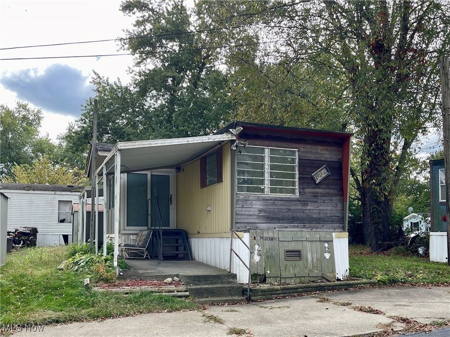 Step inside this spacious Executor mobile home featuring 3 bedrooms and 1 bath. The open great room combines the living room, dining area, and kitchen for a bright, comfortable flow. The kitchen includes a convenient breakfast bar and all appliances stay! Enjoy both front and side porches, plus a handy storage shed. Recent updates include a new furnace (2024), new hot water tank (2025), and new lighting throughout. Located just minutes from Kent State University in the desirable Whispering Pines community, which also offers a kids’ park for outdoor fun. A great deal you won’t want to miss! Park approval required through Horizon Land Management.