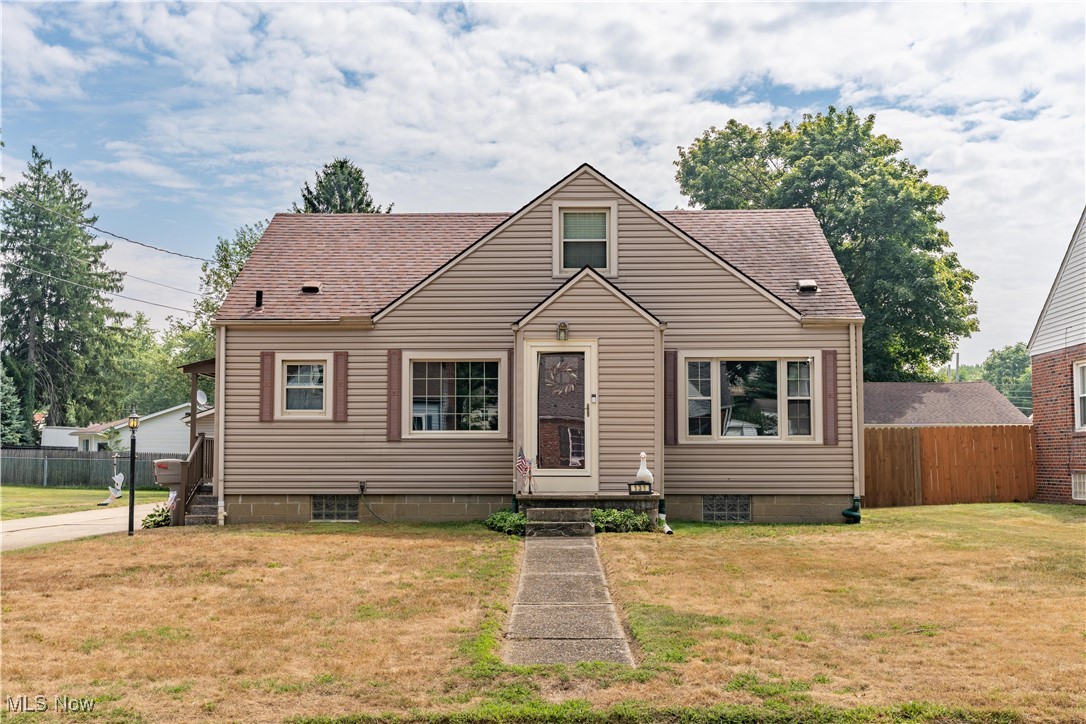 Charming and well-maintained 3-bedroom, 1-bath Cape Cod with an inviting open floor plan. The bright living and dining rooms feature large windows that fill the space with natural light. Enjoy meals in the eat-in kitchen and relax in two spacious main-level bedrooms with ample closet space. Upstairs, you’ll find a third bedroom with brand-new carpet. The full bathroom is tastefully updated with built-in storage. The basement offers built-in shelves, a workbench, and waterproofing for peace of mind. Outside, the fully fenced backyard is perfect for entertaining or pets, and the 900 sq. ft. garage with 10-ft ceilings, provides abundant storage or workshop space - can accommodate up to three vehicles. A perfect blend of comfort and function! Don’t wait—schedule your showing today!
