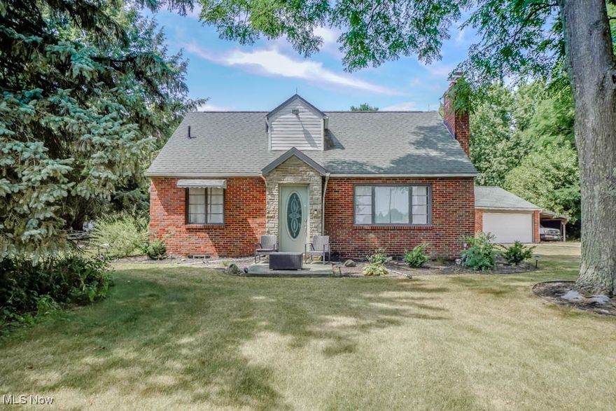 Tucked back from the road, this spacious brick cape cod sits on 1.42 acres, offering plenty of space to enjoy both inside and out! Nicely updated with a newer hot water tank, Trane furnace, and newer flooring throughout the main level. Sunlight fills the living room through a large picture window, highlighting the cozy gas fireplace. The eat-in kitchen features updated LVP flooring, painted cabinets, and stainless steel appliances, with a convenient mudroom nearby for coats and shoes. Two main floor bedrooms share easy access to a half bath, while upstairs you’ll find two more bedrooms with high ceilings and a full bath with tub and shower. The lower level is perfect for entertaining, with a rec room that includes a bar, space for games, and a lounge area for gathering with friends and family. Outside, graded flower beds with weed barrier make gardening simple, plus there are fruit trees and extra room to grow your own vegetables. A two car garage with carport, mineral rights that provide FREE GAS and a prime location close to everything make this Jackson Township home even more appealing. Schedule your showing today to see everything it has to offer!