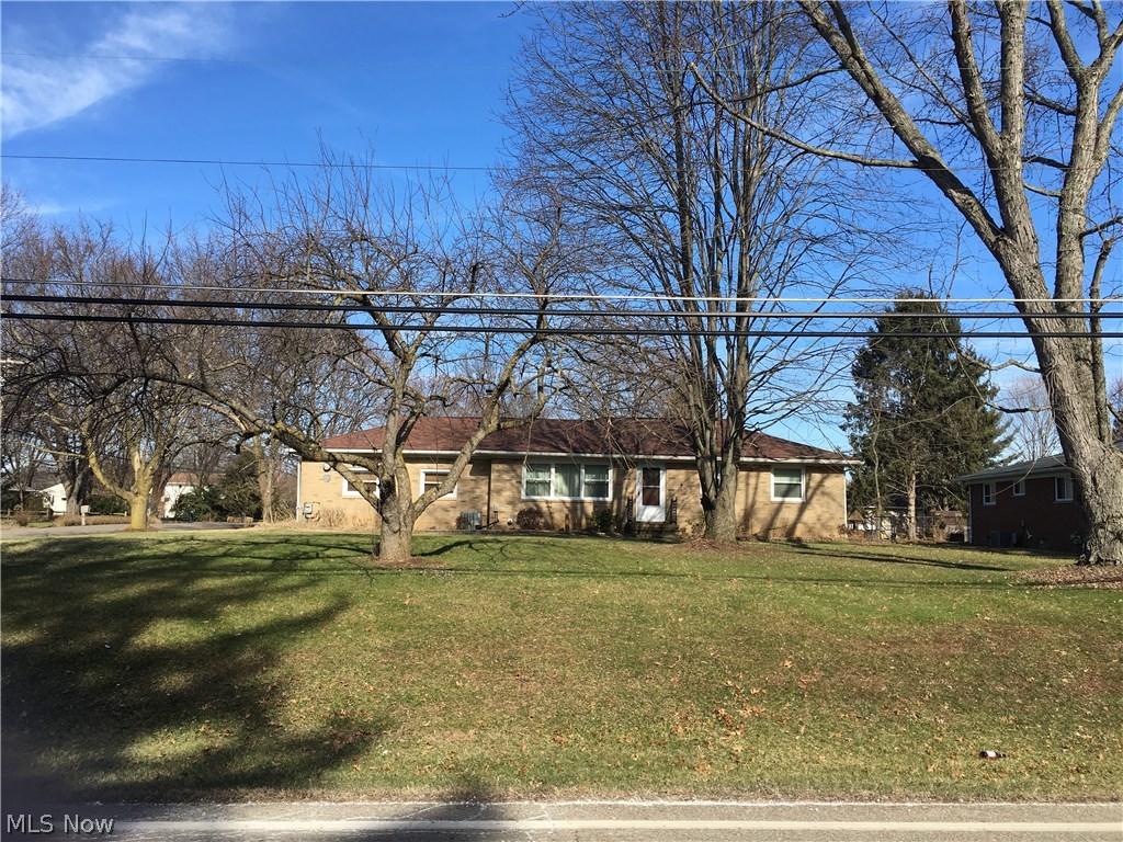 In this lovely area of homes, make this yours with a little cosmetic. Most recent improvements include kitchen self-closing cabinets, backsplash, SS sinks, pantry, microwave with hood, dishwasher, flooring in kitchen, dining and family rooms, Trane furnace and central air, ceiling fans, water softener, 100 amp electrical panel, glass block windows, Weatherseal windows, 24x12 deck, pedestal sink, insulation, and garage roof shingles. Backyard 5' high chain length fence with 2 gates offers many uses. Nice hardwood under carpeted areas. The double-sided wood fireplace accommodates living and family rooms. First floor family room would also make a great game room. Good storage in full unfinished basement. Third bedroom currently used as 1st floor laundry.
Two car detached garage. Call today
