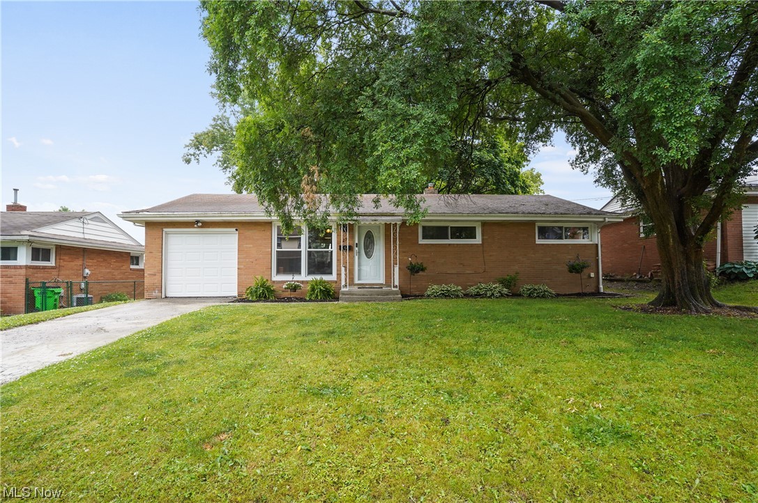 Welcome to this charming brick ranch home offering three bedrooms and one full bathroom. Come on into this beautiful, bright living room, open to the gorgeous eat in kitchen which has a wall of windows to let the natural light to shine through, all appliances 2021, including the built in microwave and white cabinets. All new flooring 2021. There are three bedrooms and a full bathroom that finishes the first level. The partially finished basement is very clean offering more space for a workout area, office, etc, laundry and storage area. Large backyard has a covered patio, plenty of space to entertain or just enjoy. There is a one car attached and three car detached garage. WOW! Precious memories begin right here!