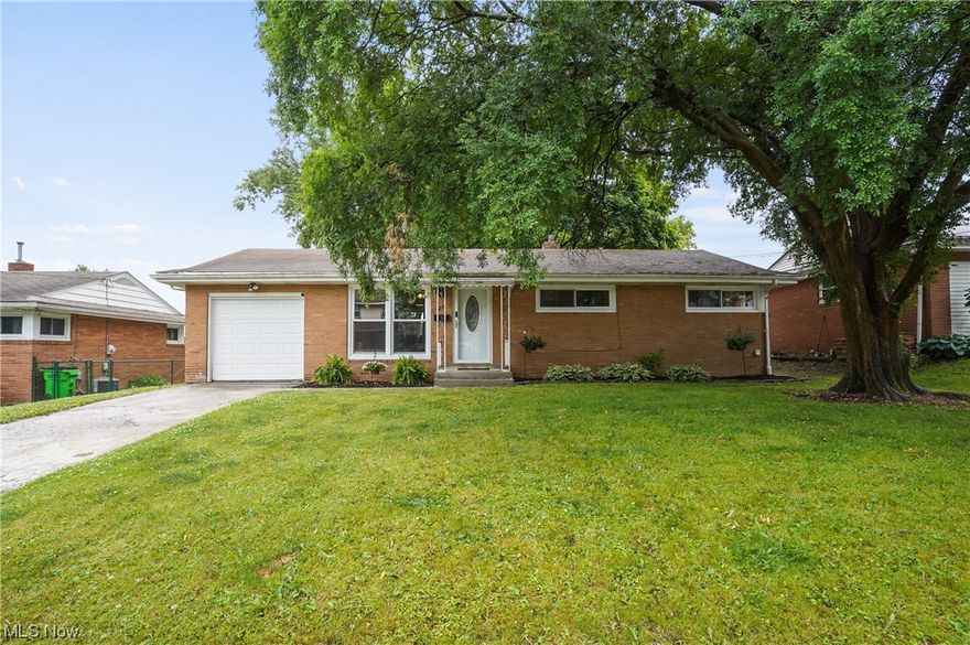 Welcome to this charming brick ranch home offering three bedrooms and one full bathroom. Come on into this beautiful, bright living room, open to the gorgeous eat in kitchen which has a wall of windows to let the natural light to shine through, all appliances 2021, including the built in microwave and white cabinets. All new flooring 2021. There are three bedrooms and a full bathroom that finishes the first level. The partially finished basement is very clean offering more space for a workout area, office, etc, laundry and storage area. Large backyard has a covered patio, plenty of space to entertain or just enjoy. There is a one car attached and three car detached garage. WOW! Precious memories begin right here!