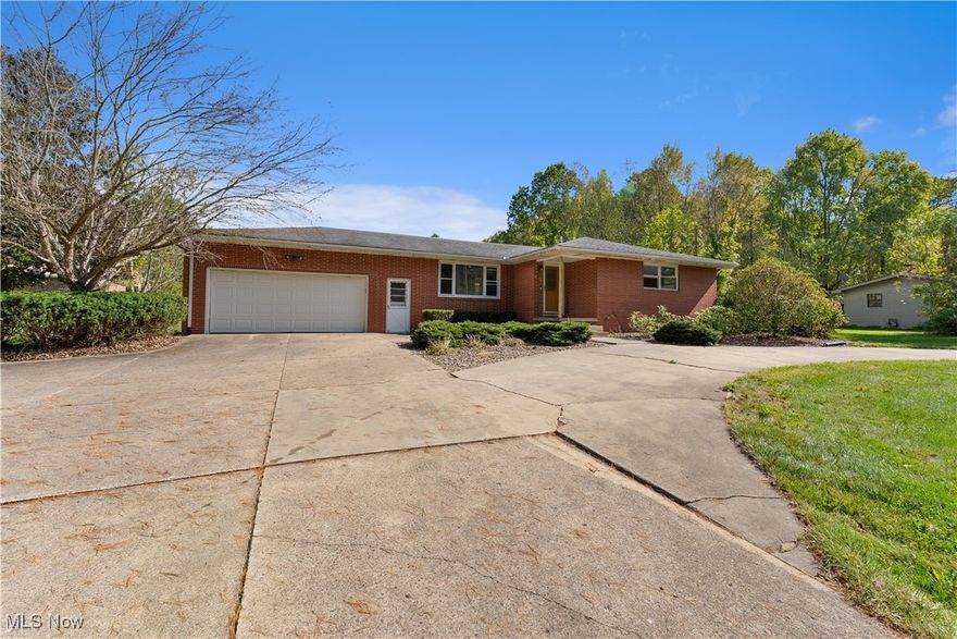 This rare Vienna Township estate has it all- over 38 stunning acres, a 3-bedroom/3-bath brick ranch, a separate studio apartment, a barn with fenced pasture, and your own lakefront paradise with multiple spring fed ponds and direct access to Girard Valley Park Lake. The main house offers almost 1,700 sq ft of comfortable living space and features an updated eat-in kitchen with maple cabinets and granite countertops. The well-designed floorplan flows from the bright living room to the den with built-in bookshelves, an electric fireplace, and a newer picture window overlooking the picturesque backyard. The primary bedroom includes its own private en suite bathroom with a tiled walk-in shower. Two well-sized bedrooms with large closets and another full bathroom complete the main level. The waterproofed basement- with a third full bath- adds potential for a gym, workshop, or bonus space and has a brand new furnace. Two concrete back patios and an above-ground pool invite outdoor relaxation, while a Generac whole-house generator, 2-car attached garage with wheelchair lift, and circular concrete driveway add convenience. Just steps away, the brick studio apartment includes a living space, kitchen, and bathroom- ideal for guests, multi-generational living, or as an income-producing rental. The barn has a metal roof, and the fenced pasture is ready for horses, livestock, or hobby farm use, with plenty of parking near both the barn and guest unit. Ownership of the southern third of Girard Valley Park Lake and four more scenic ponds offers unmatched water access for year-round outdoor enjoyment. Whether you’re reeling in fish, tending animals, or simply enjoying the peace and privacy of wooded acreage, this property delivers a hard-to-find mix of natural beauty and freedom in Mathews School District. Don’t miss your opportunity to live the lifestyle you’ve dreamed of in a fantastic location only minutes from the Youngstown-Warren Regional Airport, shopping, schools, and more!