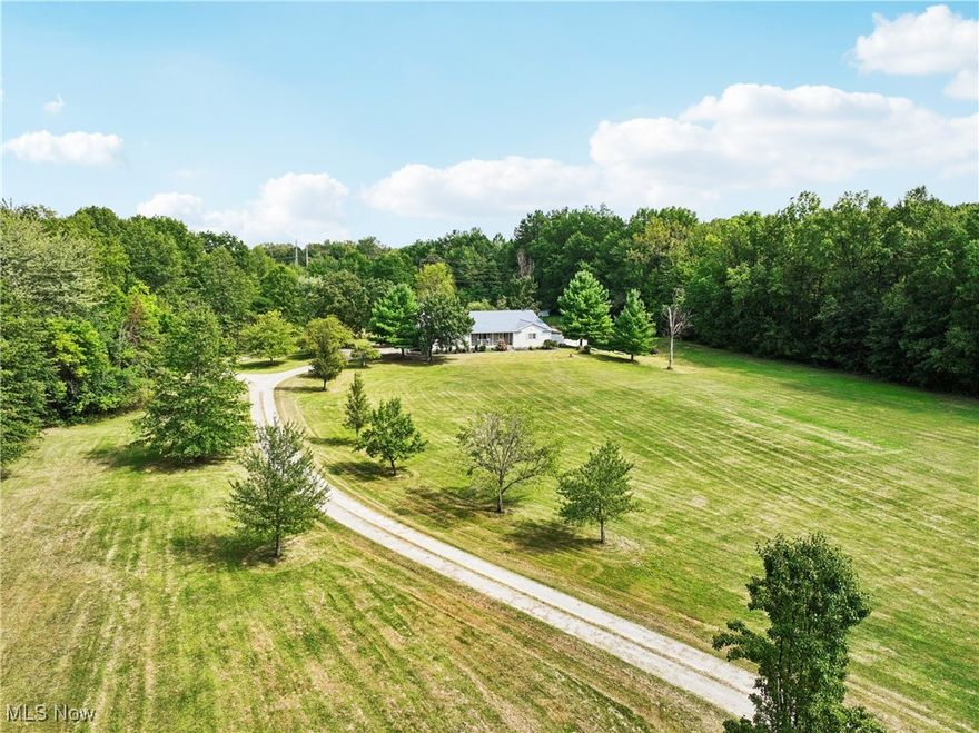 Your Private Resort Awaits! Nestled on nearly 17 acres of serene privacy, this one-of-a-kind property offers everything you’ve been searching for. Enjoy peaceful views of your very own fish-filled pond, perfect for relaxing mornings on the wraparound deck.

Inside, the main home features spacious living throughout, including a huge kitchen, a formal dining room, and a large living room ideal for entertaining. The upstairs hosts 3 generous bedrooms, while the lower level adds a 4th bedroom for extra flexibility. A full-house Generac gas generator ensures comfort and peace of mind year-round.

But the true showstopper lies in the walk-out basement, which feels like a home of its own—complete with a full kitchen, bedroom, laundry, and full bath. Perfect for multi-generational living, guests, or even private rental opportunities.

Car enthusiasts and hobbyists will fall in love with the mechanic’s dream garage, featuring an overhead door tall enough to house a motorhome and space for all your projects and toys.

Whether you’re seeking a family retreat, an entertainer’s paradise, or a private getaway, this property is truly unmatched. Don’t miss your chance to own your own private resort!