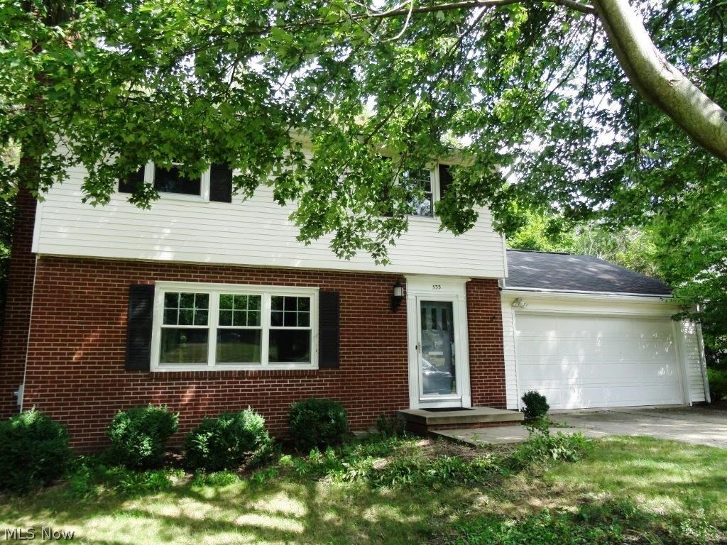 Hard to find updated west Akron colonial! 2+ attached garage, full basement, spacious flat back yard! Inside you will find an open and appealing floor plan, with newer flooring, completely remodeled kitchen w/all appliances, formal dining room, first floor office, and 3 season room! Upstairs all bedrooms are nice sized and all feature natural hardwood flooring. Tiled bathrooms, full basement and much more to offer with this one! Major updates include 2012 kitchen remodel w/stainless appliances and under cabinet lighting, furnace 2009, air 2013, hot water tank 2010, windows 2011. Don't miss out!