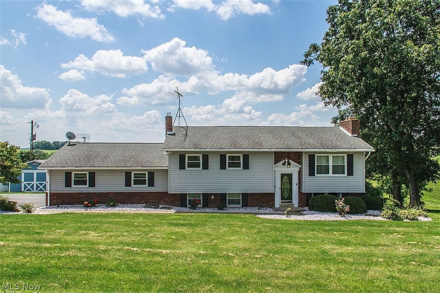 Driving up to this home just gives you a sense of the peacefulness of country living! This VERY nicely updated and well maintained 4 bed 2 bath home with a two car attached garage and paved driveway sits among matured trees and great views of a neighboring pond, all on a little over 1 acre of flat level manicured yard. Also outside is a huge storage shed for all the extras! Let's step inside..this beautiful bi-level home features an open floor plan with the kitchen leading into the dining room and living room.  The kitchen hosts beautiful cabinetry, solid counter tops and stainless steel appliances. The dining room features glass sliding doors that lead to the huge rear deck that over looks the fenced in back yard and covered patio so perfect for cook outs and summer time fun!  4 spacious, well lit bedrooms with neutral color schemes and 2 beautiful neutral bathrooms allow for your own imagination in colors.  Down a few steps to the lower level you will find the family room with a gorg