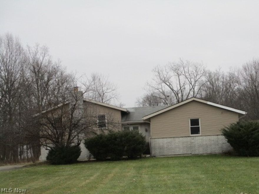 Located on over an acre lot in Oakwood Village, this is a fantastic 3 bedroom, 3 bath split with quality throughout, in need of your finishing touches and updating, over 2000 square feet of living space! Large kitchen, living, dining, great lower level! Come see