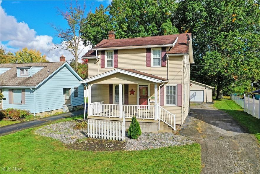 Bright, bold, and beautiful living space awaits this charming Warren home, boasting a desirable four bedroom layout, filled with tasteful updates! The two-story residence quickly stands out with its covered front patio space, perfect to kick back on a warm autumn day or night. Meanwhile, stone landscaping wraps the front of the home as the blacktop driveway continues back to find a detached two-car garage. Step inside to immerse yourself in the inviting living room, awash in the midday sun with natural light pouring from the tall, surrounding windows. Carpeted flooring extends out to find the sculpted staircase leading to the second-floor bedrooms.  Around the corner, enjoy a home-cooked meal in the gracious formal dining room, complete with hardwood flooring and its decorative hanging light. The prominent kitchen completes the floor as it showcases its long-running stone-look countertops and a colorful dining nook that oversees the backyard. Upstairs, the main hall branches away into the quartet of impressively spacious bedrooms, each painted in endearing colorways and filled with hardwood-type flooring. The cozy 4th bedroom is perfect for a home office. A deep-set full bath joins them at mid hall with its window lined vanity. Storage and laundry are located at the basement level. Additional features and updates include: above-ground pool can stay, vinyl replacement windows throughout, roof 2012, hot water tank 2023, freshly painted interior 2024, and so much more! Plus a one-year home warranty!